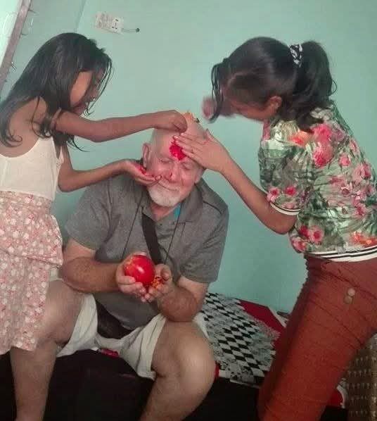 Receiving a Tika mark to his forehead as a blessing in Kathmandu.